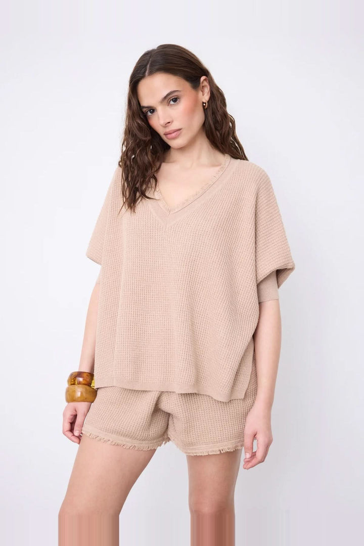 V-neck poncho sweater with three-quarter sleeves