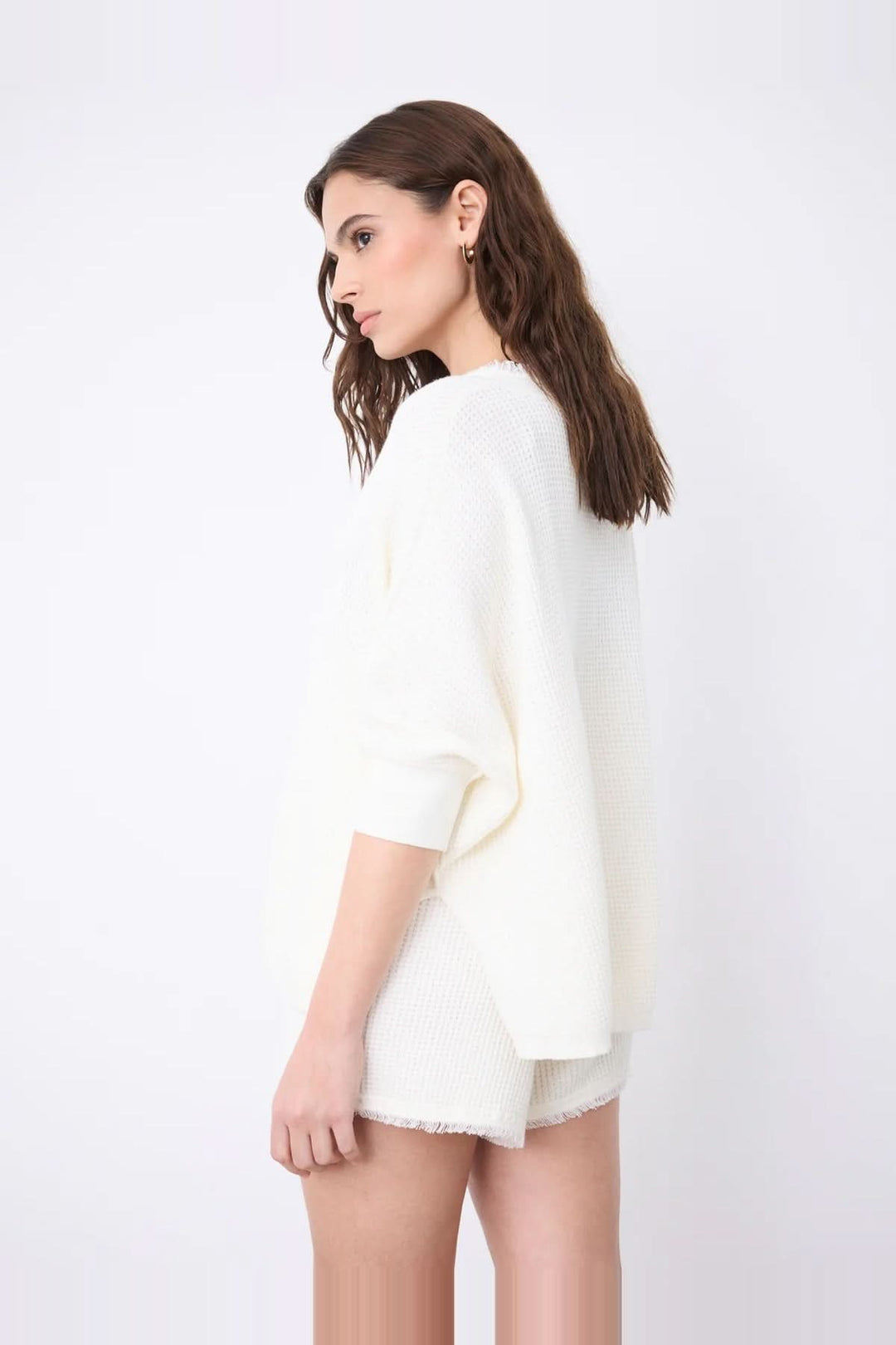V-neck poncho sweater with three-quarter sleeves