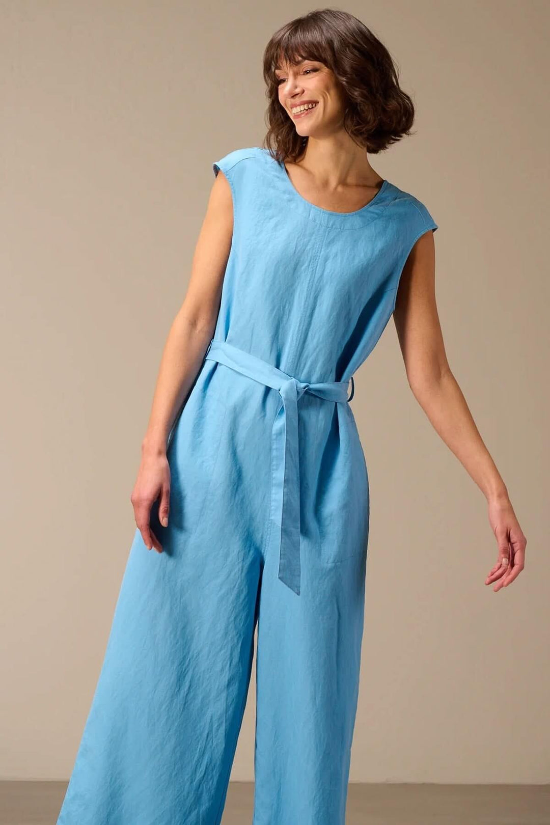 Sleeveless jumpsuit with a tie-waist belt