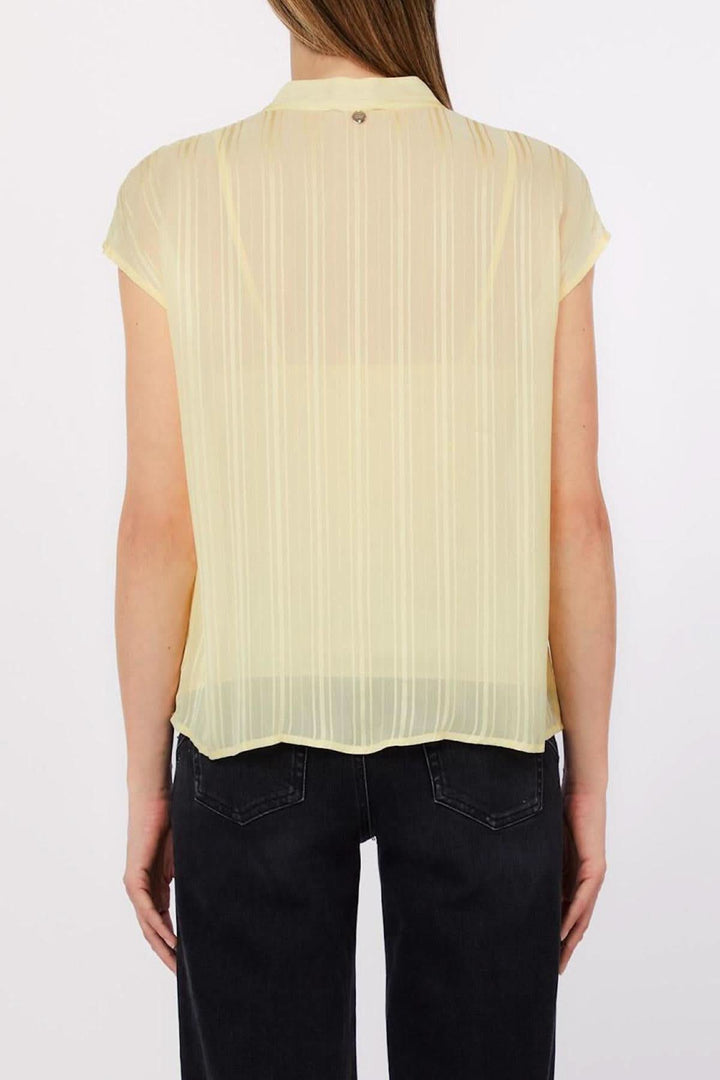 Flowy blouse with an open neckline