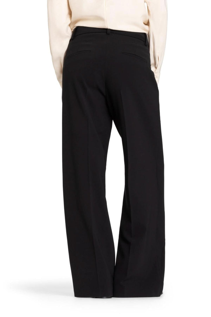 Pantalon Anais à jambe large, vue arrière, offrant confort et élégance, parfait pour le bureau ou le quotidien.