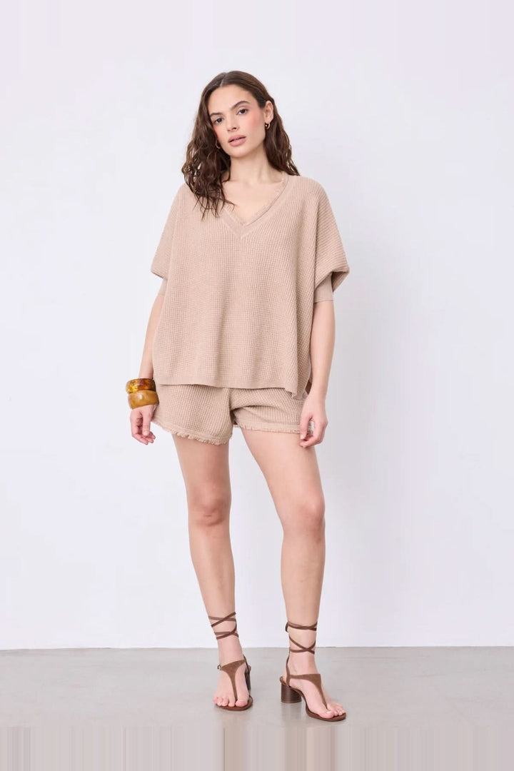 V-neck poncho sweater with three-quarter sleeves