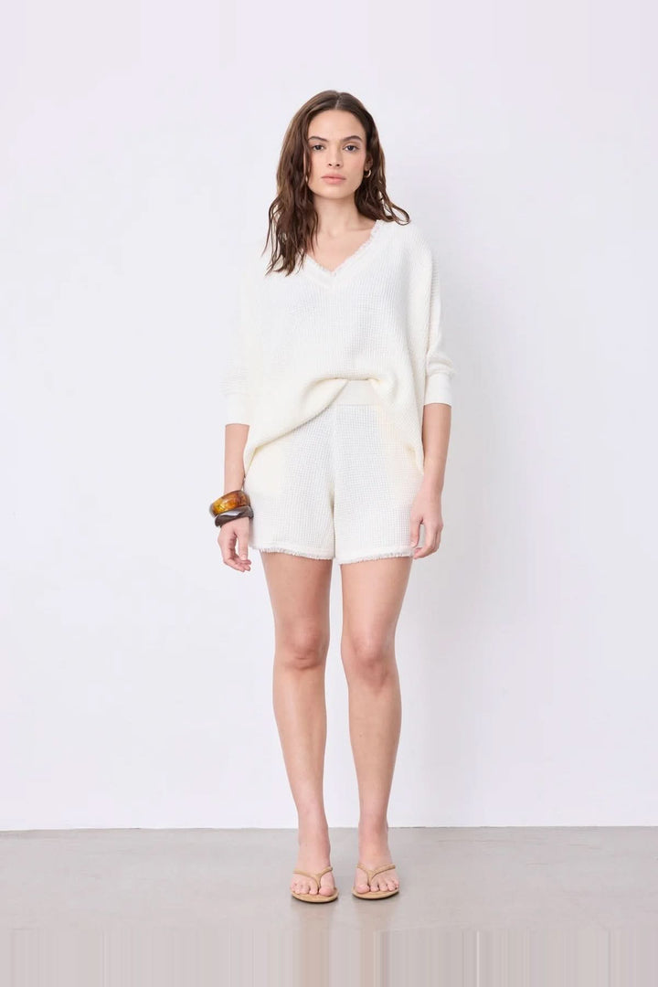 V-neck poncho sweater with three-quarter sleeves