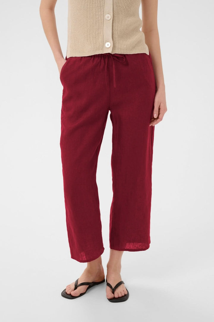 Pantalon de lin Berita rouge fluide et confortable avec taille élastique et cordon, coupe droite, idéal pour l'été.