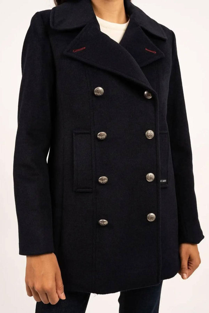 Manteau Briac noir en tissu marin, avec col cranté et double boutonnage métallique, style urbain et intemporel.
