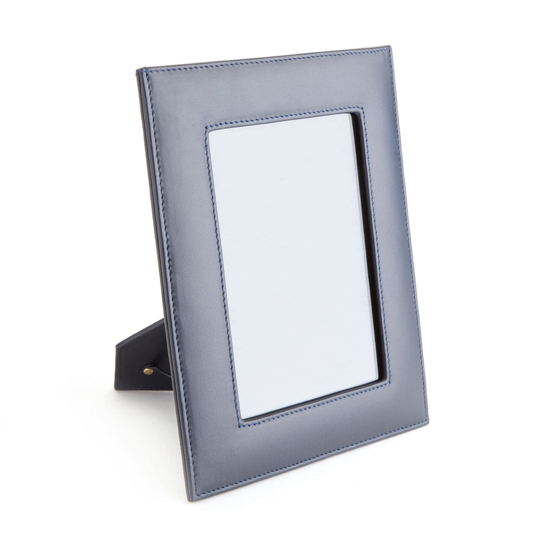 5" x 7" navy leather picture frame with a convenient drop-down door for easy photo access.