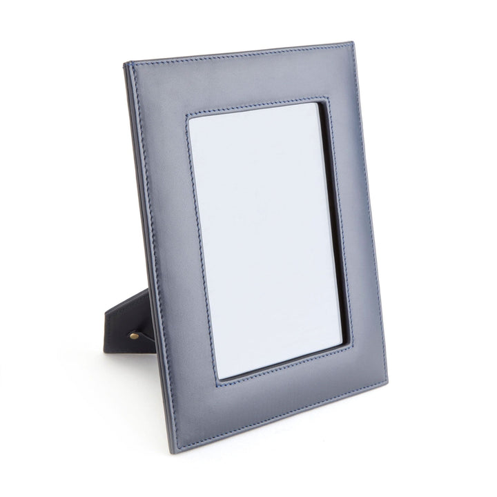 5" x 7" navy leather picture frame with a convenient drop-down door for easy photo access.