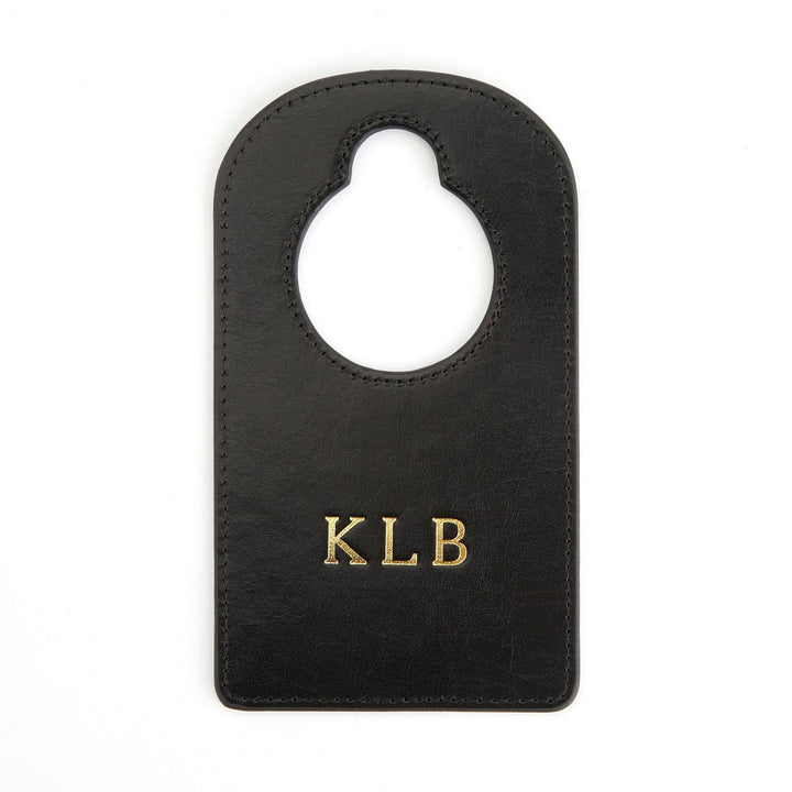 Handcrafted leather door knob hanger with gold monogram KLB, perfect for personalizing your bedroom or nursery decor.