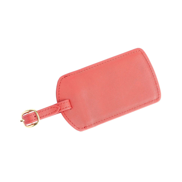 Handcrafted pink leather luggage tag with gold tone hardware and adjustable strap, perfect for personalized travel.