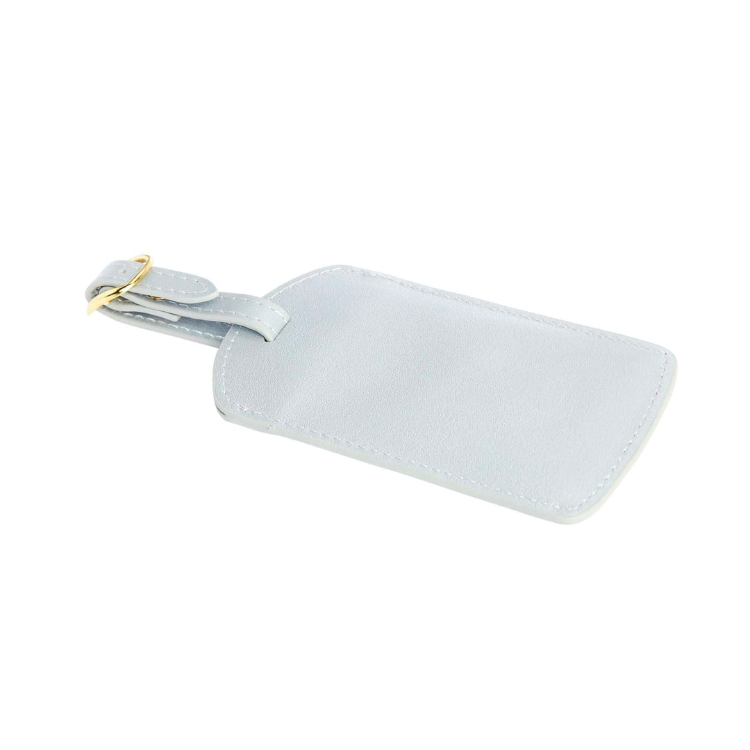 Handcrafted light blue leather luggage tag with gold tone hardware and adjustable strap, perfect for stylish travel.