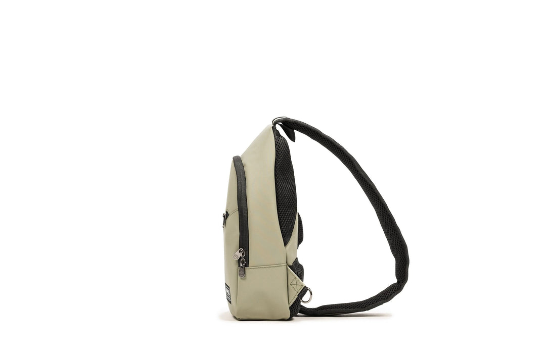 PKG Elora Recycled Cross Body pack in grey, showcasing its lightweight design and padded shoulder strap.