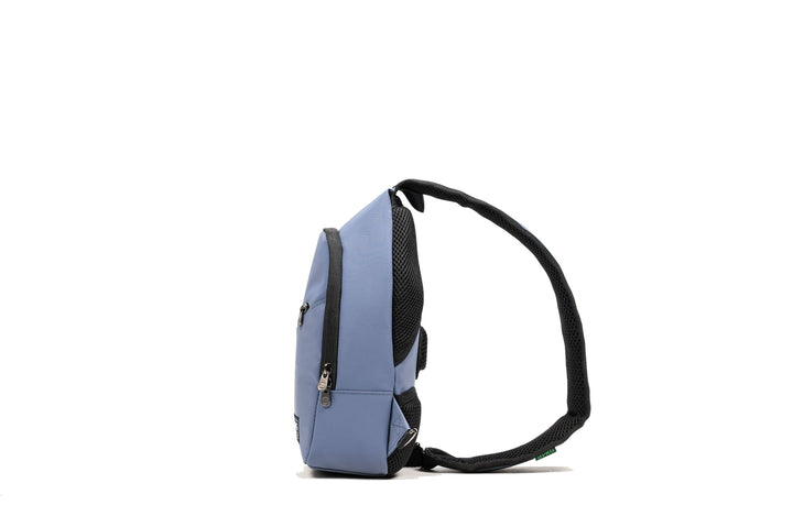 Side view of PKG Elora Recycled Cross Body fanny pack featuring waterproof material and padded shoulder strap.