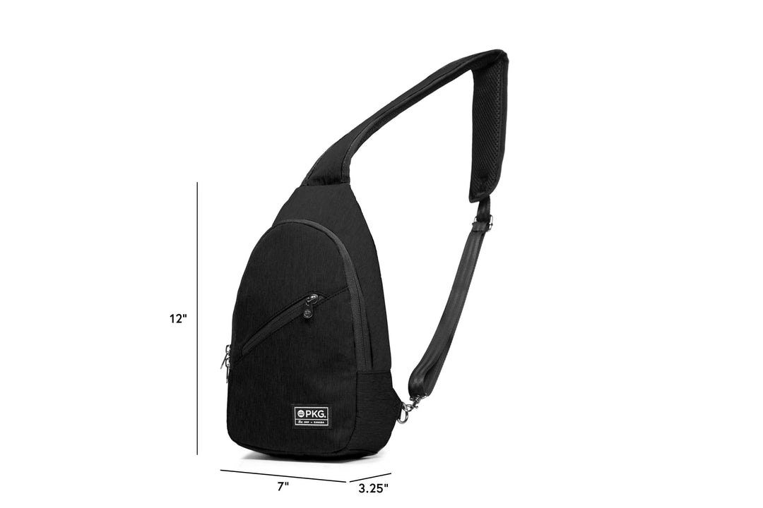 PKG Elora recycled crossbody bag in black with padded strap, waterproof recycled materials, and multiple pockets.