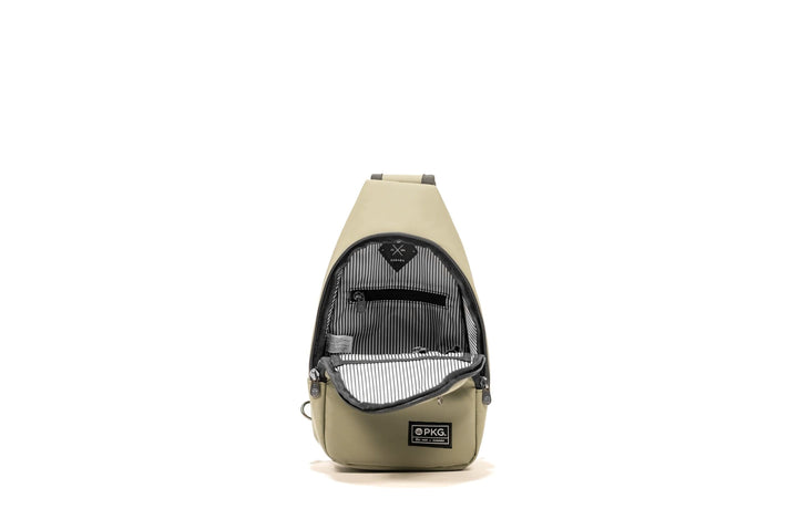 Open view of the PKG Elora Recycled Cross Body, featuring waterproof material and striped interior pockets.