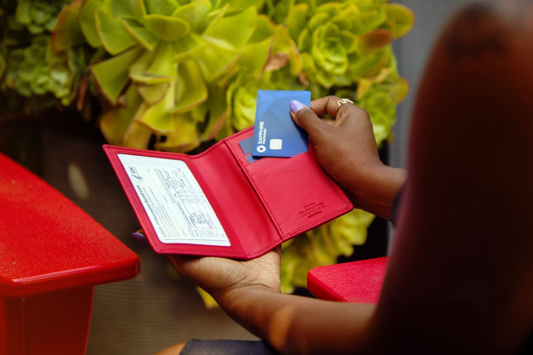 RFID blocking vaccine card holder showcasing clear window and card storage in stylish red wallet.